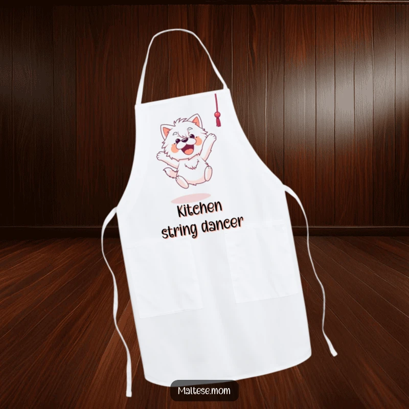 Funny Maltese apron showing a Maltese dog joyfully leaping towards a dangling string, ready to assist with kitchen fun.