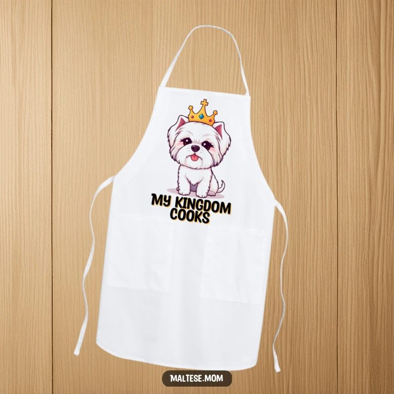 Funny Maltese dog apron featuring a cute white dog wearing a tiny crown, looking regal and amused while cooking.