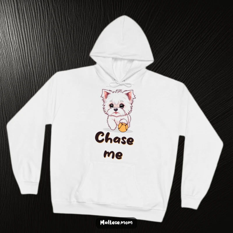 Funny Hoodie featuring a cute Maltese dog character with bright eyes, playfully chasing a ball, perfect for cozying up.