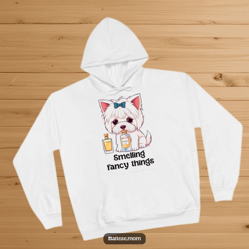Funny hoodie with a Maltese dog character delicately sniffing a perfume bottle, combining comfort and chic style.
