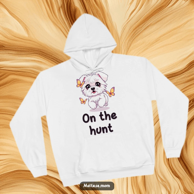 Funny Kawaii Maltese dog with sparkling eyes, chasing a butterfly, cozy and humorous hoodie design.