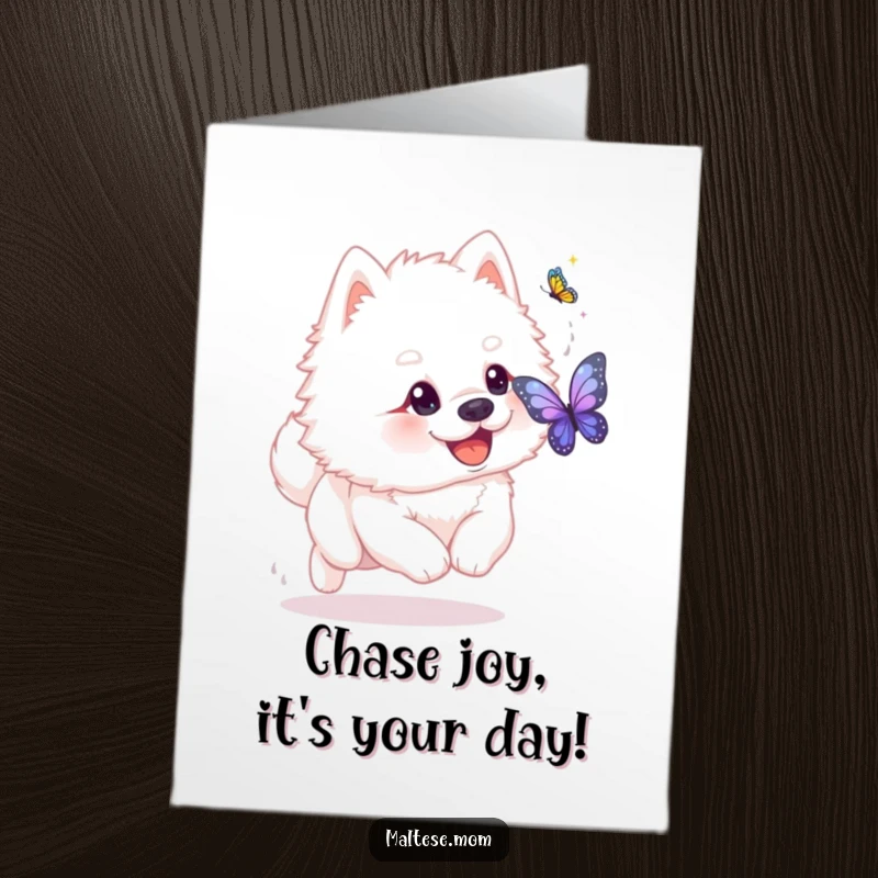 Funny free printable birthday card: a fluffy white dog with a playful glint in its eye chases a shimmering butterfly.
