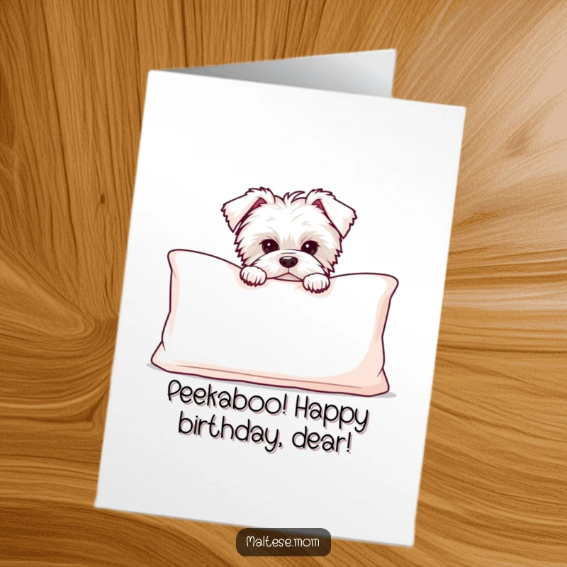 Funny free printable birthday card: a shy Maltese puppy peeking out from behind a large, fluffy cushion.