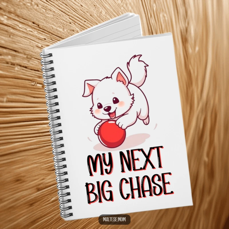 Funny Notebook with a white dog with a perky tail chasing a bright red ball, perfect for jotting down energetic thoughts.